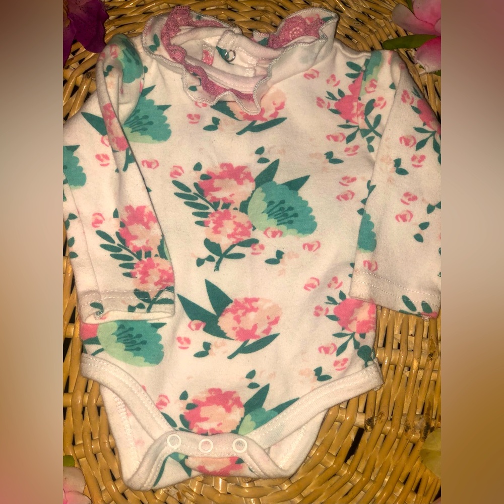 White with floral design long sleeve onesie